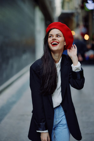 Fashion woman smile with teeth portrait stroll tourist in stylish clothes with red lips walking down narrow city street curves, travel, cinematic color, retro vintage style, Valentines Day.